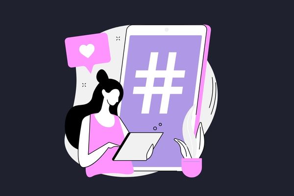 A woman using hashtags is one of the successful social media strategy examples